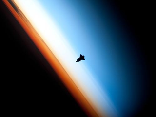 Illustration for article titled The Precarious Light-Filled Vista From The International Space Station